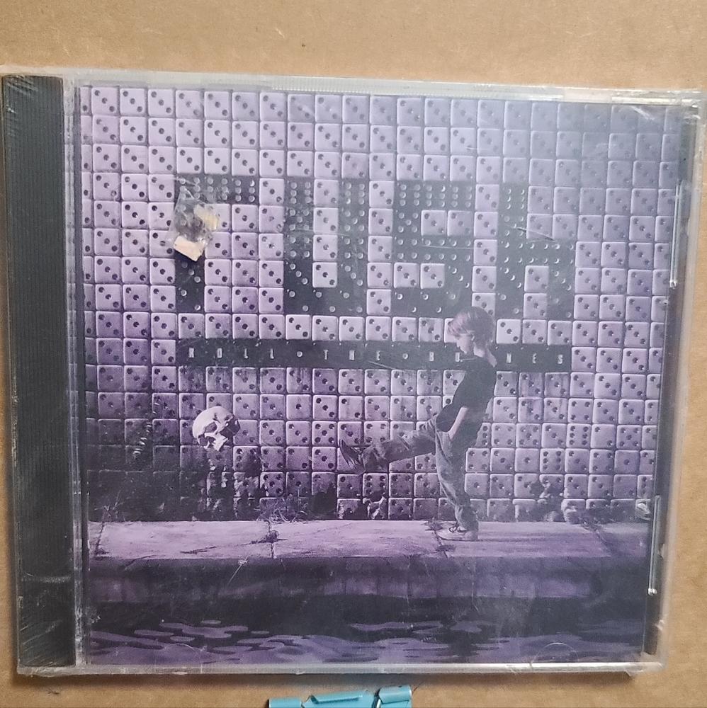 Rush Roll the Bones i have not played this cd.new in plastic  As is
